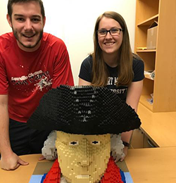 Hannah Arnold and Andrew Mason with their LEGO bust of Robert Morris.